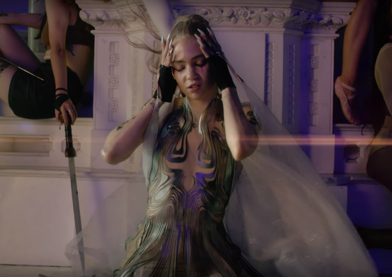 Grimes in the music video for ‘Violence’ (YouTube)