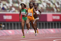 Marie-Josee Ta Lou, of the Ivory Coast, wins a heat in the women's 100-meter run at the 2020 Summer Olympics, Friday, July 30, 2021, in Tokyo. (AP Photo/Martin Meissner)