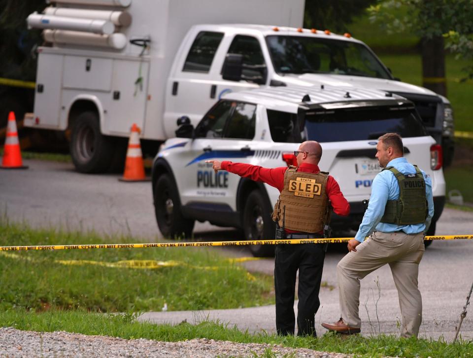 Officers and investigators with the Spartanburg Police Department, Spartanburg County Sheriff's Office, and SLED, were at the scene of multiple shooting near Cleveland Park Drive and Amelia Street in Spartanburg, Thursday afternoon,  July  1, 2021. Two employees with the Spartanburg Water System, as well as a Spartanburg County Sheriff's deputy responding to the incident, were shot.