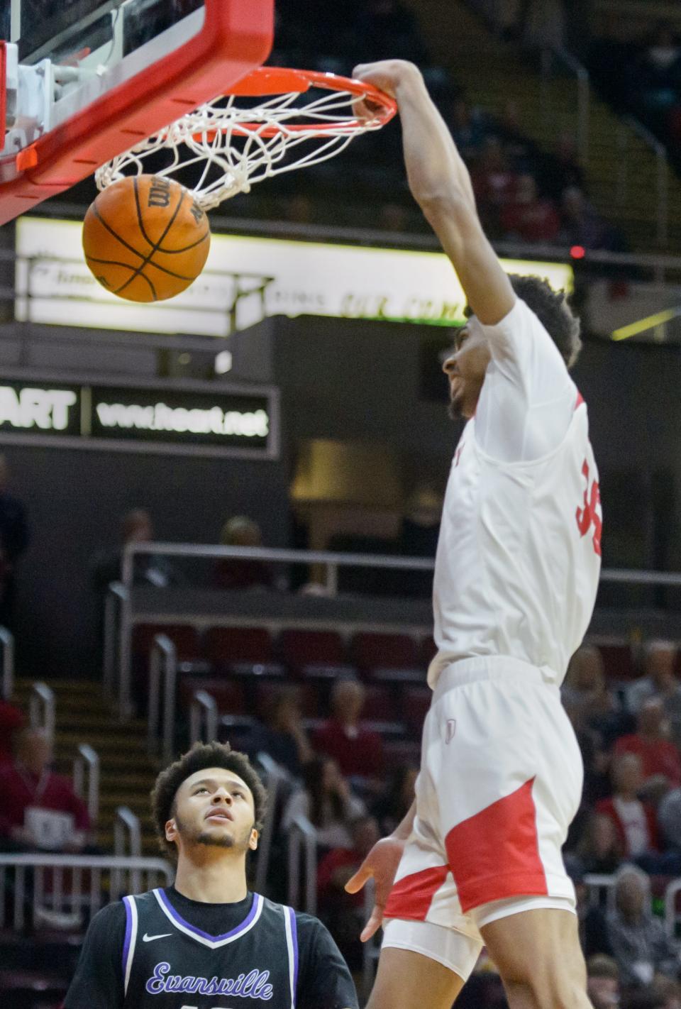 Bradley's Darius Hannah dunks over Evansville's Chris Moncreif in the first half Wednesday, Jan. 11, 2023 at Carver Arena in Peoria. The Braves defeated the Aces 91-46.