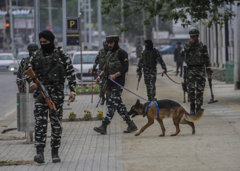 Indian paramilitary soldiers patrol a street in Srinagar, Indian controlled Kashmir, Tuesday, May 16, 2023. Indian authorities have stepped up security and deployed elite commandos to prevent rebel attacks during the meeting of officials from the Group of 20 industrialized and developing nations in the disputed region next week. (AP Photo/Mukhtar Khan)