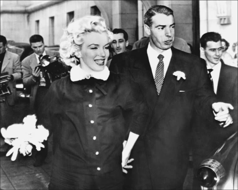 Picture dated April 1, 1954 shows actress Marilyn Monroe with her second husband American baseball player Joe DiMaggio leaving the city hall of San Francisco after their marriage