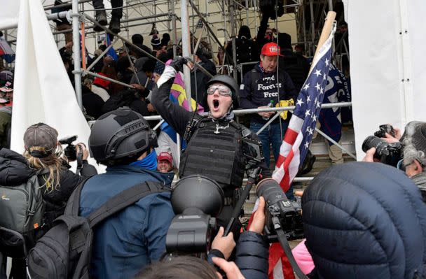 PHOTO: A man calls on people to raid the building as Trump supporters clash with police and security forces as they try to storm the US Capitol in Washington D.C, Jan. 6, 2021. (Joseph Prezioso/AFP via Getty Images)