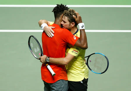 Tennis - ATP 500 - Rotterdam Open - Rotterdam Ahoy, Rotterdam, Netherlands - February 17, 2019 France's Gael Monfils and Switzerland's Stan Wawrinka after their Final match REUTERS/Eva Plevier