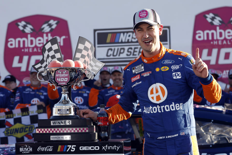 Joey Logano celebrates in Victory Lane after winning the NASCAR Cup Series auto race at Atlanta Motor Speedway, Sunday, March 19, 2023, in Hampton, Ga. (AP Photo/Butch Dill)