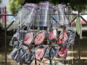 Face shields and printed masks are sold during an enhanced community quarantine to prevent the spread of the new coronavirus in Manila, Philippines on Thursday April 23, 2020. (AP Photo/Aaron Favila)