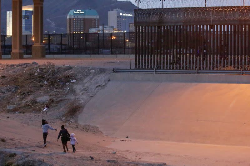 Migrants are seen after crossing the Rio Bravo river to turn themselves in to U.S. Border Patrol agents to request for asylum in El Paso, Texas, U.S., as seen from Ciudad Juarez
