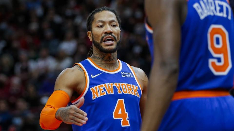 Nov 21, 2021; Chicago, Illinois, USA; New York Knicks guard Derrick Rose (4) reacts after a play against the Chicago Bulls with guard RJ Barrett (9) during the second half at United Center. The Chicago Bulls won 109-103. Mandatory Credit: Jon Durr-USA TODAY Sports