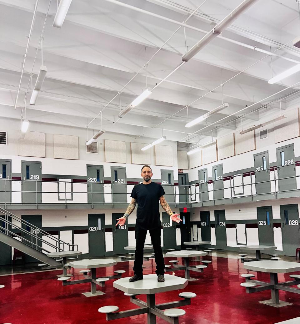 Nathan Lee, founder of Send Musicians to Prison, stands in a common area at a Metro Nashville Detention Facility where his organization recently hosted musical performances for the inmates.