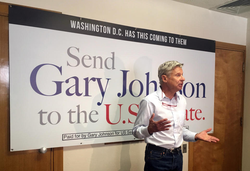 Former Libertarian presidential candidate and New Mexico U.S. Senate race candidate Gary Johnson talks to reporters Thursday, Aug. 16, 2018, during a media availability in Albuquerque, N.M. Johnson talked about his decision to join the race and how he would represent a state dependent on three military bases and two national labs. (AP Photo/Russell Contreras)