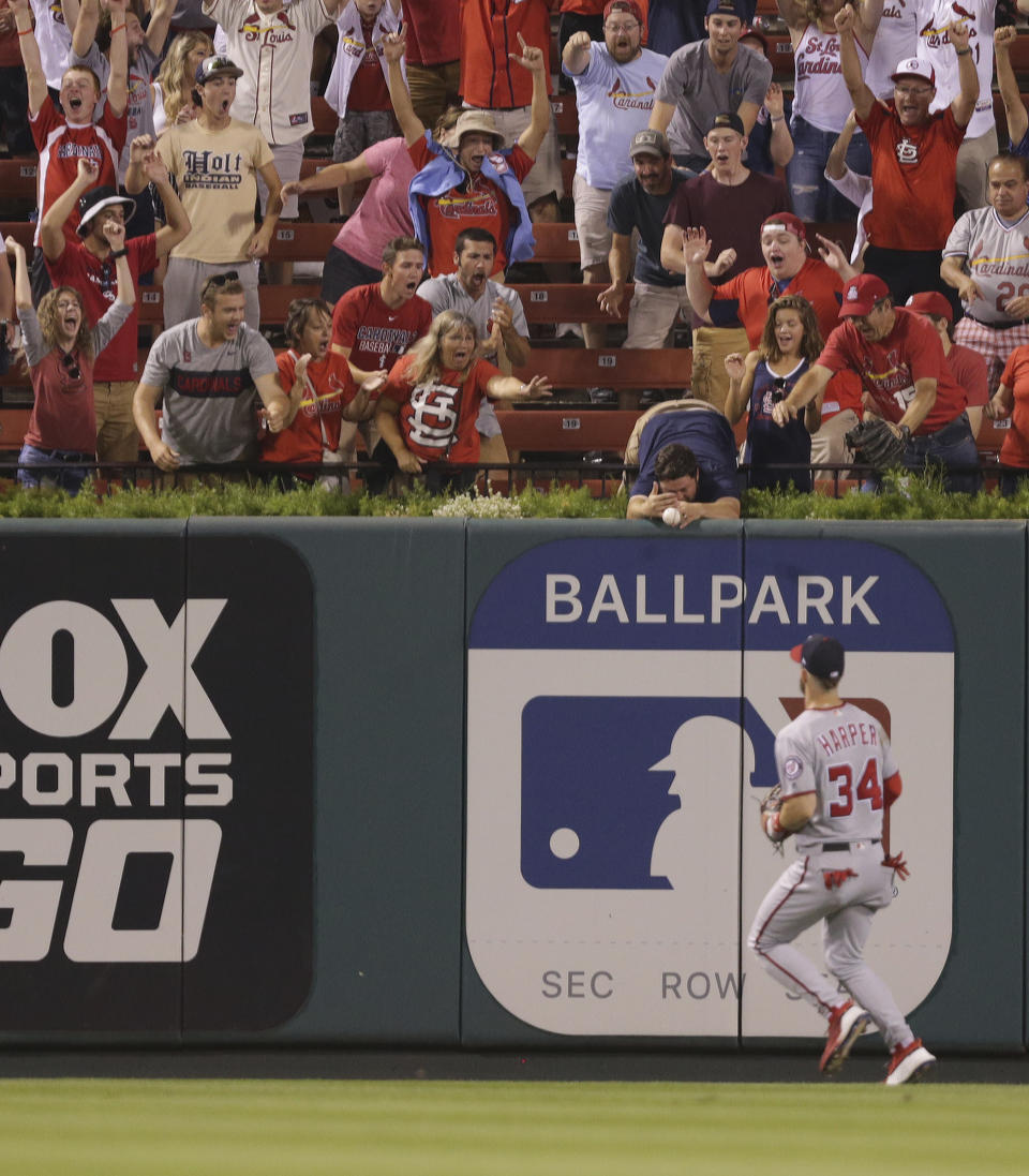 Washington Nationals center fielder Bryce Harper watches as a three-run home run by St. Louis Cardinals' Matt Carpenter just clears the wall in the eighth inning of a baseball game, Monday, Aug. 13, 2018, in St. Louis. The Cardinals defeated the Nationals 7-6. (AP Photo/Tom Gannam)