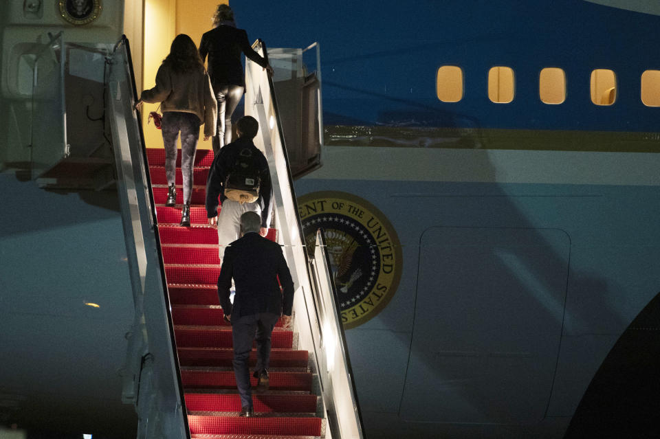 President Joe Biden, bottom, first lady Jill Biden, top, and their grandchildren Natalie and Robert, board Air Force One at Andrews Air Force Base, Md., Tuesday, Dec. 27, 2022. Biden and his family are traveling to St..Croix, U.S. Virgin Islands to celebrate the New Year. (AP Photo/Cliff Owen)