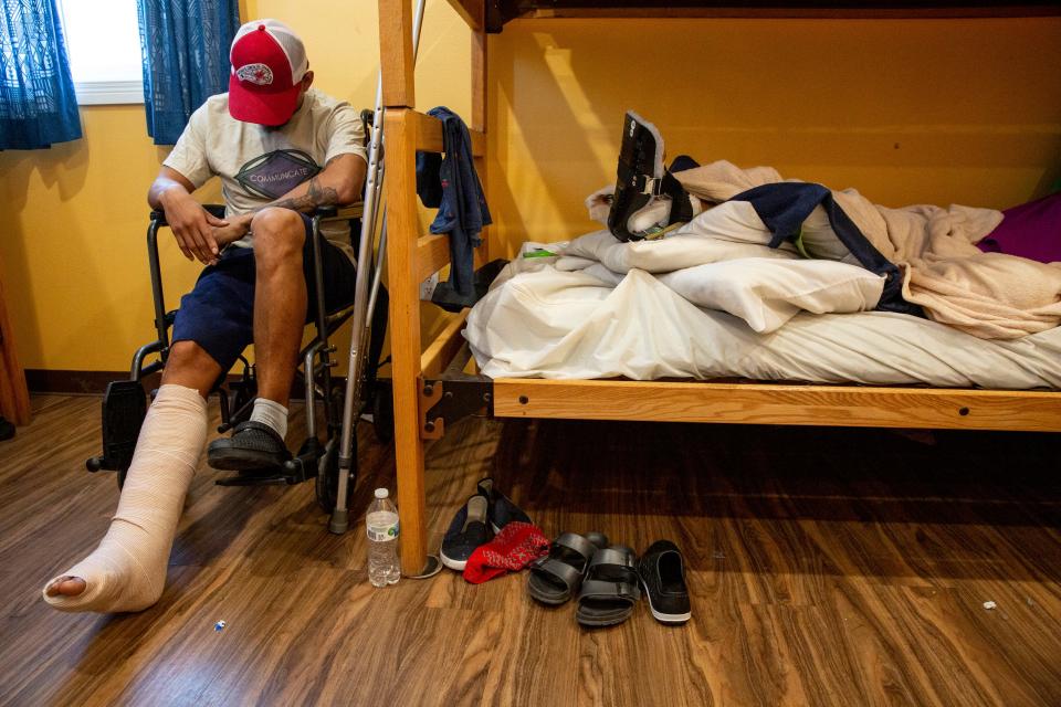 A man from Mexico is photographed recovering at a migrant shelter in El Paso, Texas, after fracturing his ankle after he fell from the border wall in October.