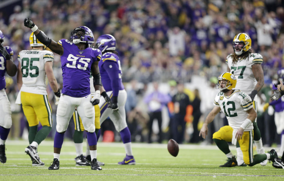 Minnesota Vikings defensive end Ifeadi Odenigbo (95) celebrates after sacking Green Bay Packers quarterback Aaron Rodgers (12) during the second half of an NFL football game Monday, Dec. 23, 2019, in Minneapolis. (AP Photo/Andy Clayton-King)