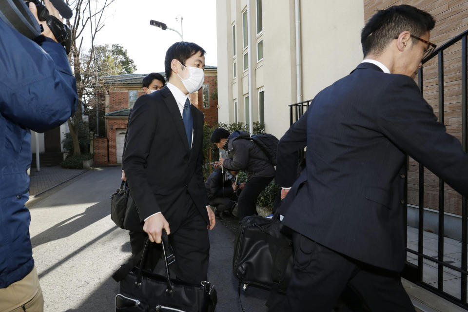 Prosecutors arrives at former Nissan Chairman Carlos Ghosn's residence for a raid in Tokyo Thursday, Jan. 2, 2020. Japanese prosecutors raided his Tokyo home after he skipped bail and fled to Lebanon before his trial on financial misconduct charges. (Yuki Sato/Kyodo News via AP)