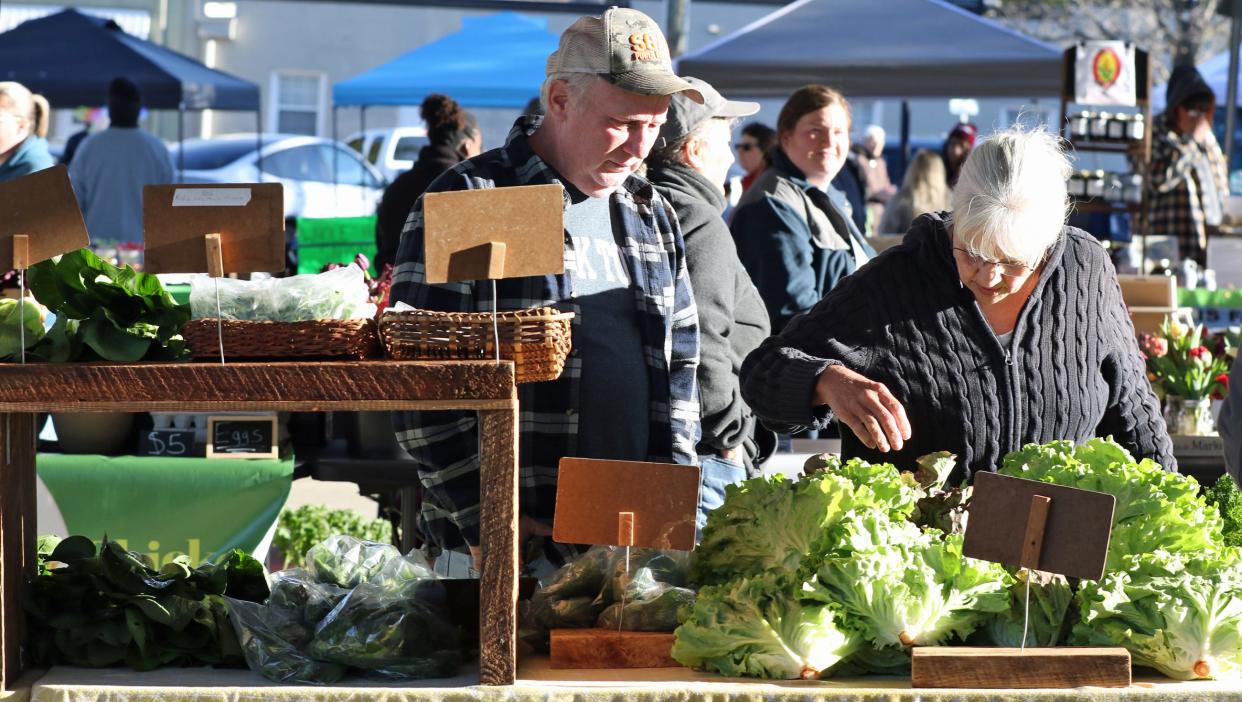 People braved the cool weather early Saturday morning, April 6, 2024, for the opening of the Foothills Farmers Market on West Marion Street in Shelby.