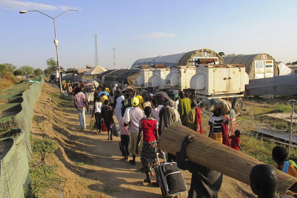 Civilians arrive for shelter at the United Nations Mission in the Republic of South Sudan compound in Bor, South Sudan