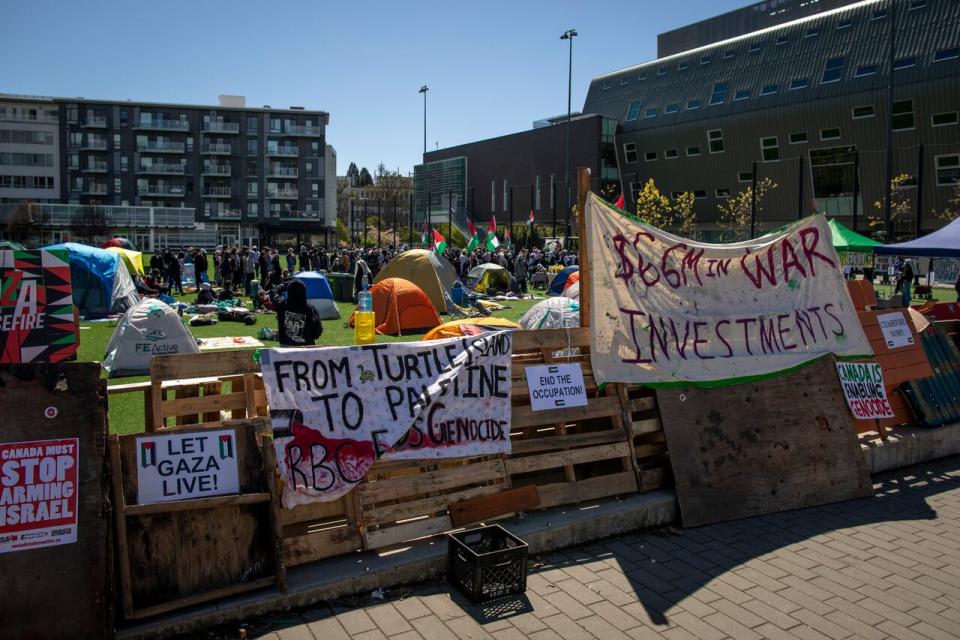 Supporters of Palestine are pictured while setting up an encampment in protest of UBC investments at UBC near Vancouver, B.C on Monday April 29, 2024. 