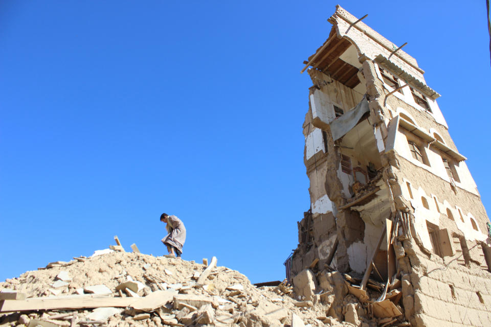 A boy walks on the rubble of a house destroyed by a recent Saudi-led air strike in the northwestern city of Saada, Yemen on January 4, 2017 (Photo: Naif Rahma / Reuters)