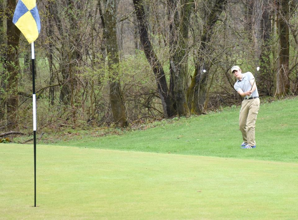 Little Falls Mountie Christian White chips onto the green on hole No. 1 at the Little Falls Municipal Golf Course during Wednesday's match against Poland and West Canada Valley.