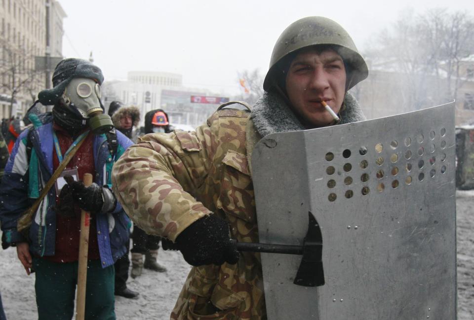 Pro-European protesters gather during clashes with riot police in Kiev