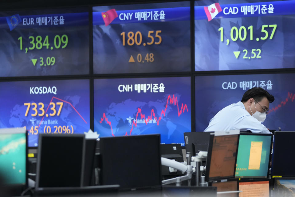 A currency trader checks monitors at the foreign exchange dealing room of the KEB Hana Bank headquarters in Seoul, South Korea, Monday, Nov. 21, 2022. Asian stock markets sank Monday after Wall Street ended with a loss for the week amid anxiety about Federal Reserve plans for more interest rate hikes to cool inflation. (AP Photo/Ahn Young-joon)