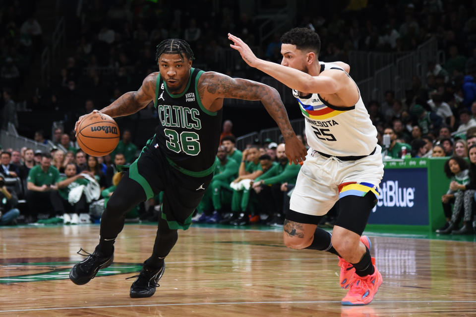 Boston Celtics guard Marcus Smart (36) controls the ball while Minnesota Timberwolves guard Austin Rivers (25) defends during the first half at TD Garden Credit: Bob DeChiara-USA TODAY Sports