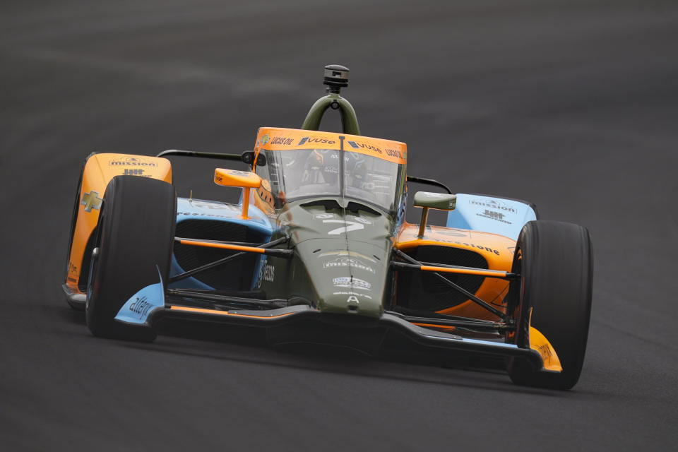 Felix Rosenqvist, of Sweden, drives through the first turn during qualifications for the Indianapolis 500 auto race at Indianapolis Motor Speedway in Indianapolis, Saturday, May 21, 2022. (AP Photo/Michael Conroy)