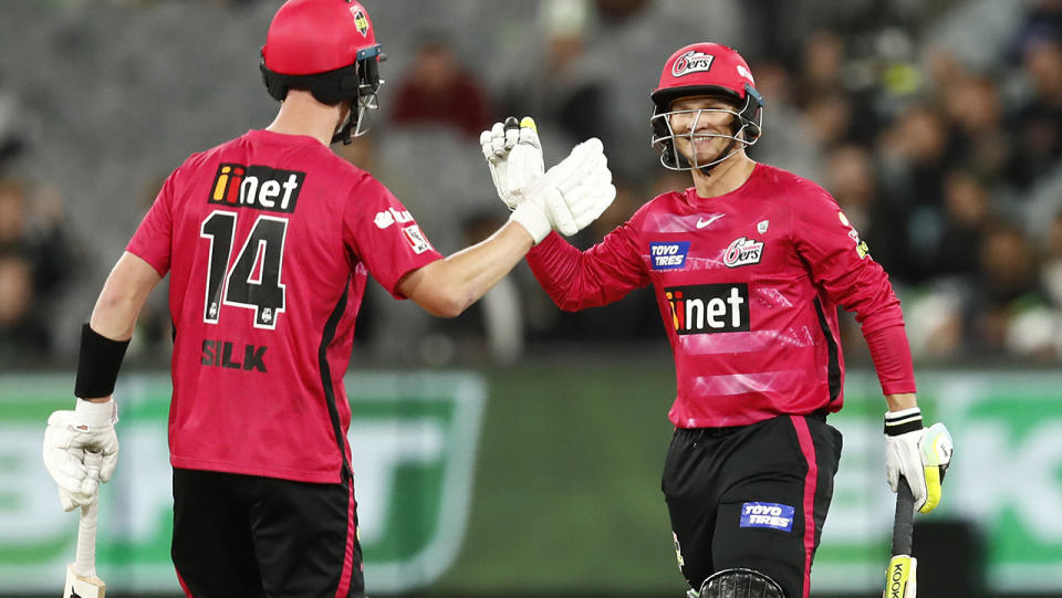 Jordan Silk and Josh Philippe, pictured here celebrating after securing victory for the Sydney Sixers.