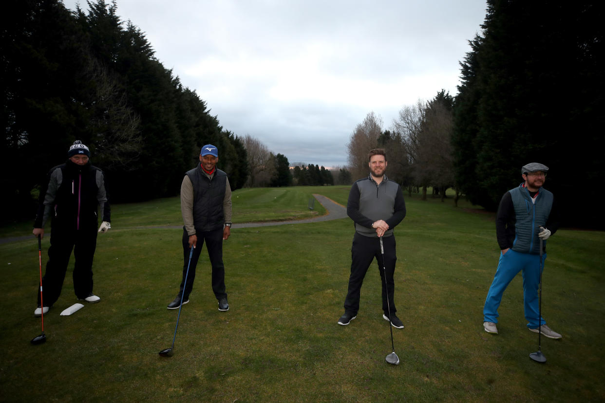 Golfers socially distance ahead of teeing off at the first tee at Telford Golf Club, Telford, Shropshire, following the easing of England's lockdown to allow far greater freedom outdoors. Picture date: Monday March 29, 2021.