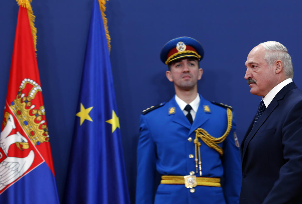 Belarus President Alexander Lukashenko, right, arrives for a press conference after talks with his Serbian counterpart Aleksandar Vucic at the Serbia Palace in Belgrade, Serbia, Tuesday, Dec. 3, 2019. Lukashenko is on a two-day official visit to Serbia. (AP Photo/Darko Vojinovic)