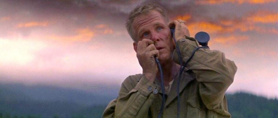 Nick Nolte holding a communicator to his ear