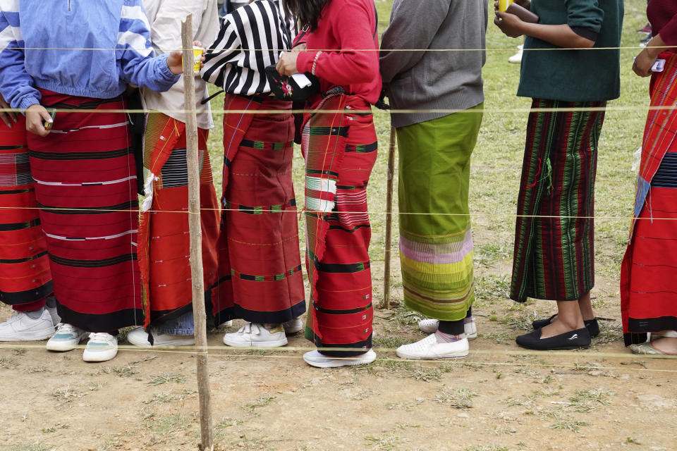 Tangkhul Nagas stand in a queue to cast their votes in Shangshak village, in the northeastern Indian state of Manipur, Friday, April 26, 2024. (AP Photo/Yirmiyan Arthur)