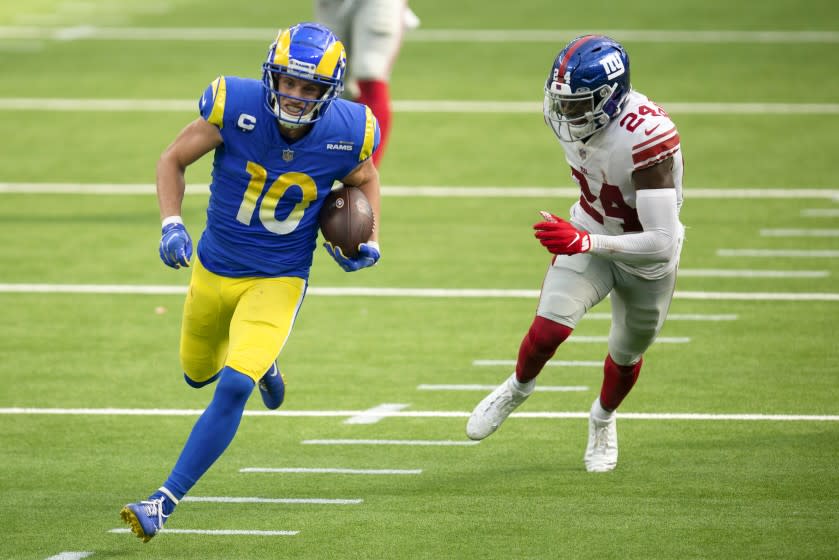 Los Angeles Rams wide receiver Cooper Kupp (10), left, sprints for a touchdown past New York Giants cornerback James Bradberry (24) during an NFL football game, Sunday, Oct. 4, 2020, in Inglewood, Calif. (AP Photo/Kyusung Gong)