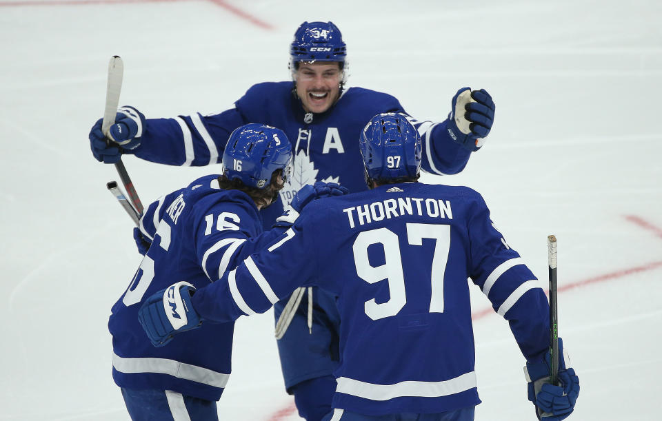 Toronto, ON- January 9  -  Toronto Maple Leafs center Joe Thornton (97) celebrates with Toronto Maple Leafs center Auston Matthews (34) after Toronto Maple Leafs center Mitch Marner (16) scores in second period action as the Toronto Maple Leafs hold their annual Blue versus White intersquad game  at ScotiaBank Arena in Toronto. January 9, 2021.     The game is played before an empty arena as Ontario faces stricter restrictions to slow the spread of the COVID-19 pandemic        (Steve Russell/Toronto Star via Getty Images)