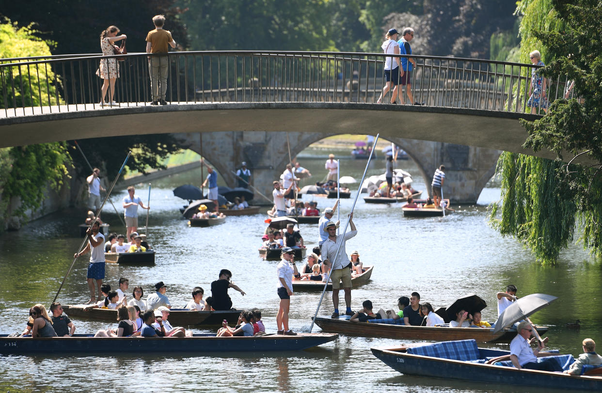 People punt along the River Cam in Cambridge, as the UK could encounter the hottest July day on record later this afternoon.