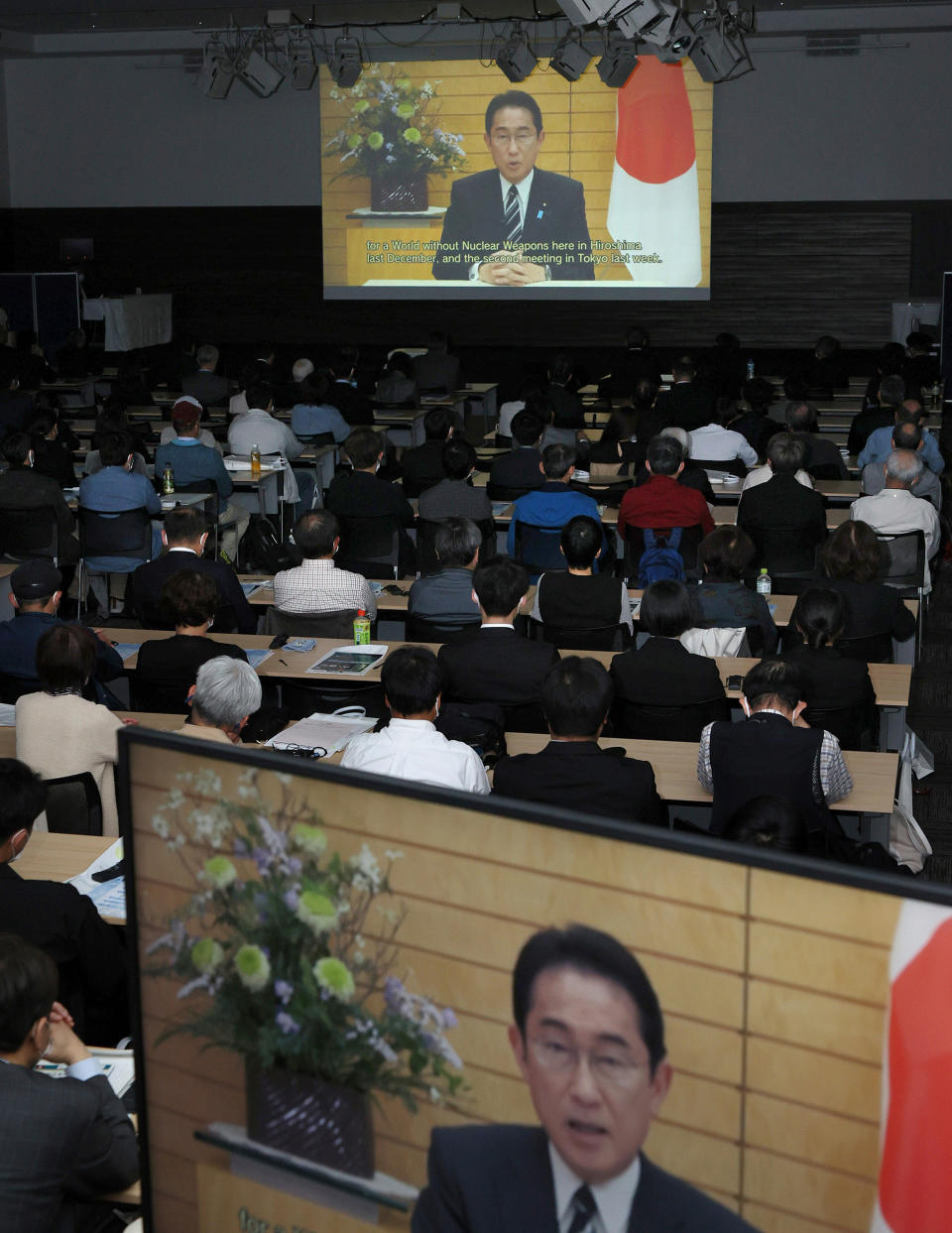 Japanese Prime Minister Fumio Kishida delivers a video message during the G7 Summit Commemorative Symposium at the Hiroshima Convention Hall on April 15.<span class="copyright">The Yomiuri Shimbun/AP</span>