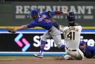 Milwaukee Brewers' Jackie Bradley Jr. is forced out at second with Chicago Cubs' Eric Sogard covering during the second inning of a baseball game Tuesday, April 13, 2021, in Milwaukee. (AP Photo/Morry Gash)