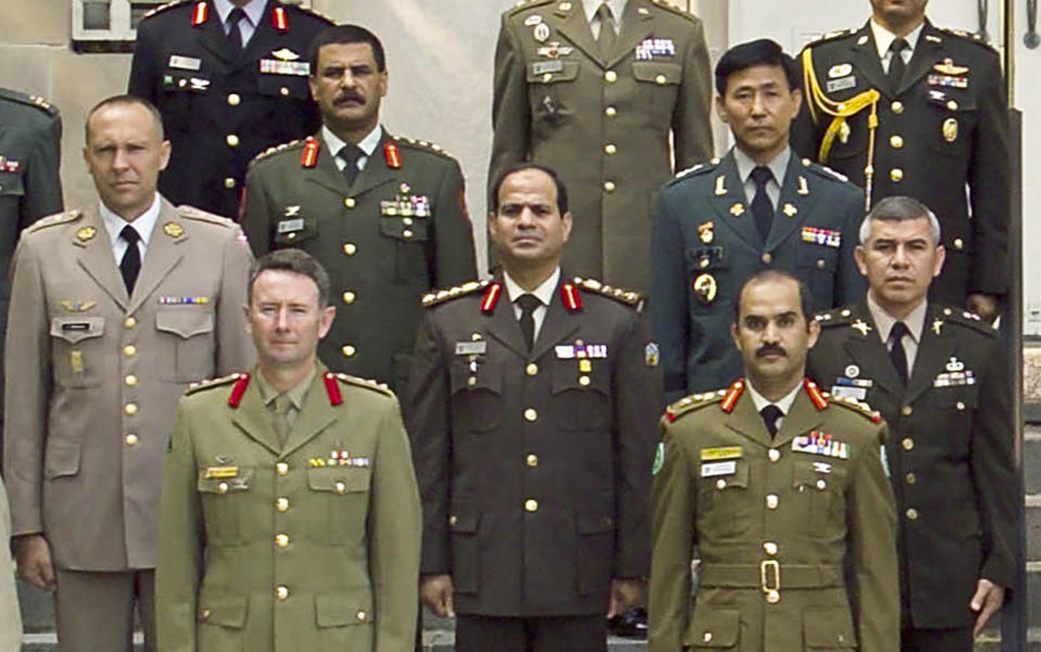 ALTERNATE CROP - This undated 2006 photograph provided by the U.S. Army War College photo lab shows Egyptian Brig. Gen. Abdel-Fattah el-Sissi, center, in a group photo of the International Fellows class of 2006 in Carlisle, Pennsylvania. The head of Egypt’s military, Abdel-Fattah el-Sissi, is riding on a wave of popular fervor that is almost certain to carry him to election as president. Unknown only two years ago, a broad sector of Egyptians now hail him as the nation’s savior after he ousted the Islamists from power, and the state-backed personality cult around him is so eclipsing, it may be difficult to find a candidate to oppose him if he runs. Still, if he becomes president, he faces the tough job of ruling a deeply divided nation that has already turned against two leaders. (AP Photo/U.S. Army War College photo lab)