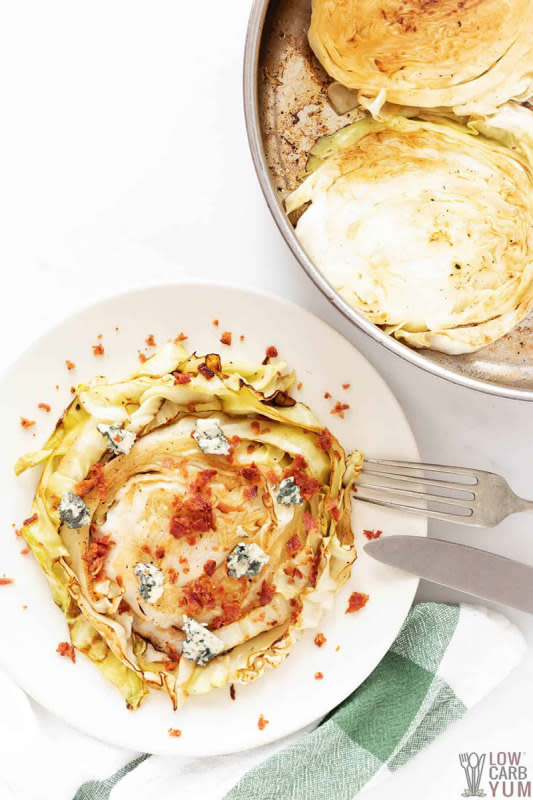 <p>Low Carb Yum</p><p>Yummy grilled cabbage steaks with blue cheese and bacon. A simple recipe that cooks up in no time on the grill or in a pan on the stove.</p><p><strong>Get the recipe:</strong><a href="https://lowcarbyum.com/grilled-cabbage-steaks-blue-cheese-bacon/" rel="nofollow noopener" target="_blank" data-ylk="slk:Cabbage Steaks with Bacon;elm:context_link;itc:0;sec:content-canvas" class="link "> <strong>Cabbage Steaks with Bacon</strong></a></p><p><strong>Related: 30 <a href="https://www.yahoo.com/lifestyle/30-most-saved-cabbage-recipes-145711966.html" data-ylk="slk:Best Cabbage Recipes For An Easy Meal;elm:context_link;itc:0;sec:content-canvas;outcm:mb_qualified_link;_E:mb_qualified_link;ct:story;" class="link  yahoo-link">Best Cabbage Recipes For An Easy Meal</a></strong></p>