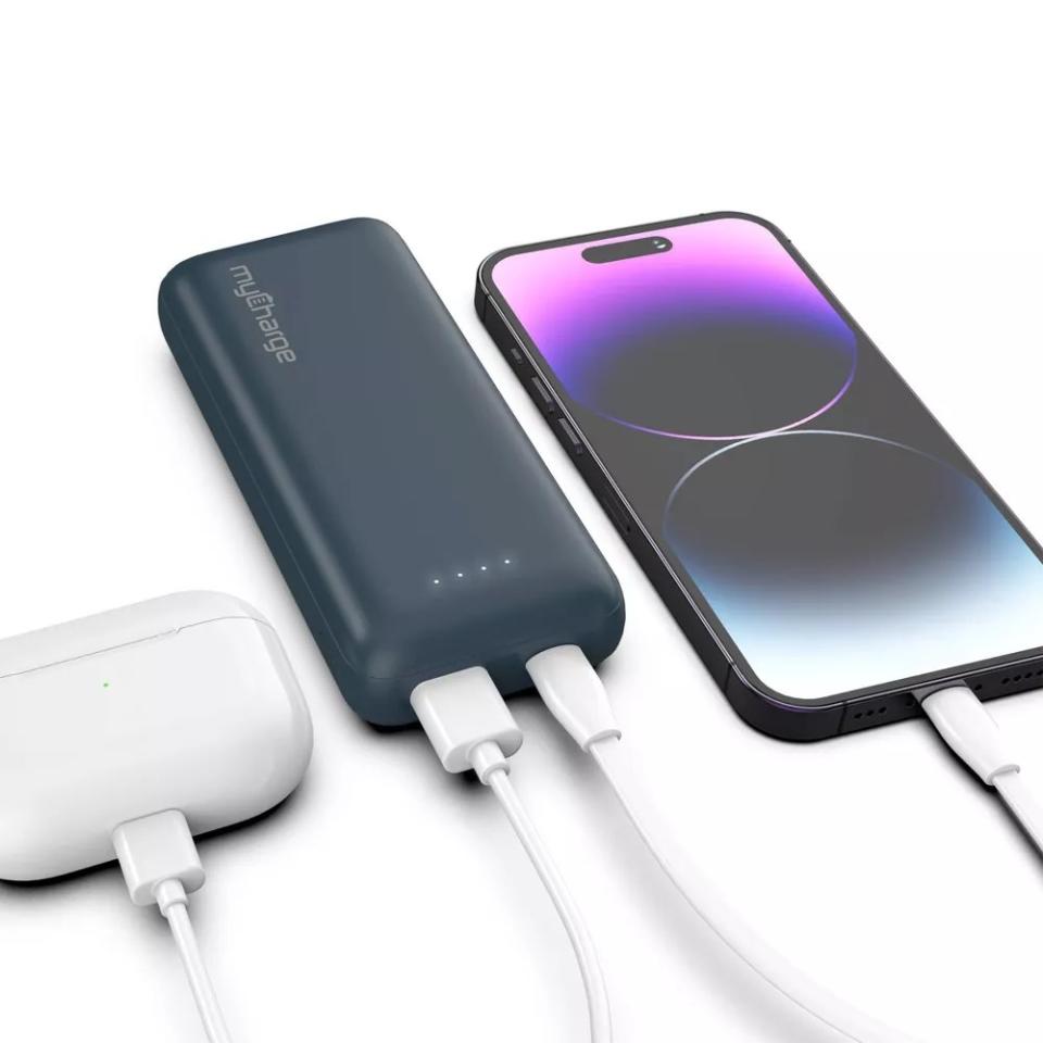 blue portable charger charger smartphone and wireless earbuds