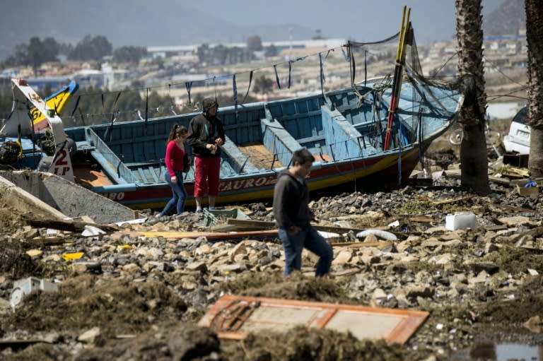 The coastal city of Coquimbo clearly showed the devastation of the earthquake in a jumble of fishing boats, remains of homes, trucks, vendors' stands and cars washed up by tsunami waves