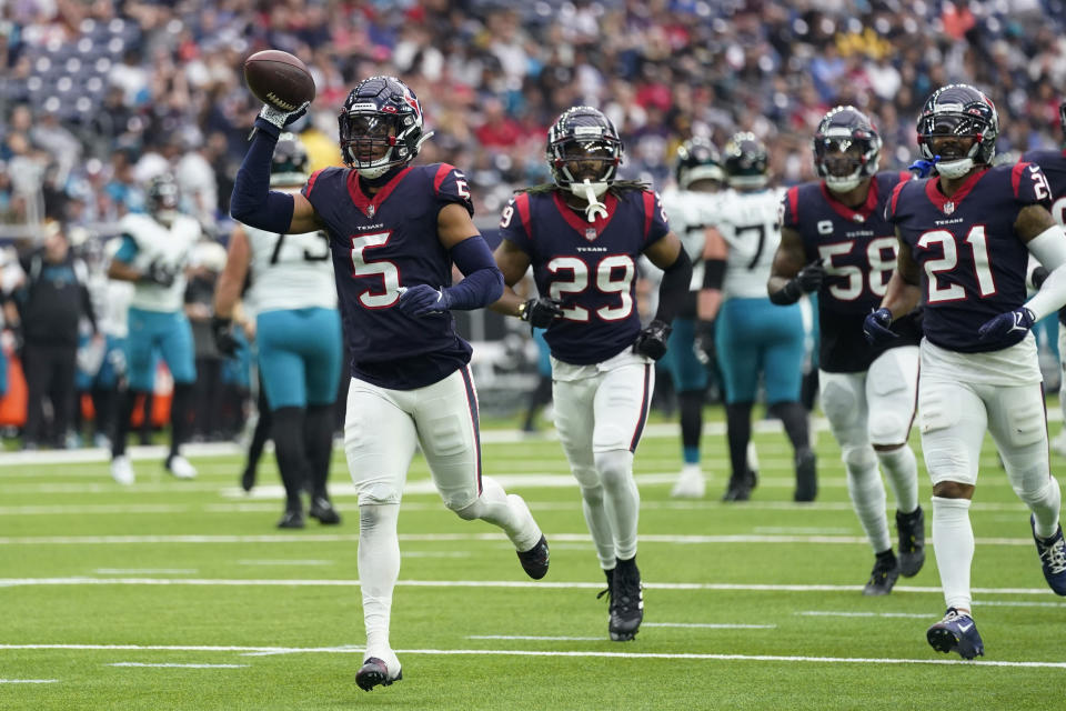 Houston Texans safety Jalen Pitre (5) celebrates his interception against the Jacksonville Jaguars during the second half of an NFL football game in Houston, Sunday, Jan. 1, 2023. (AP Photo/Eric Christian Smith)