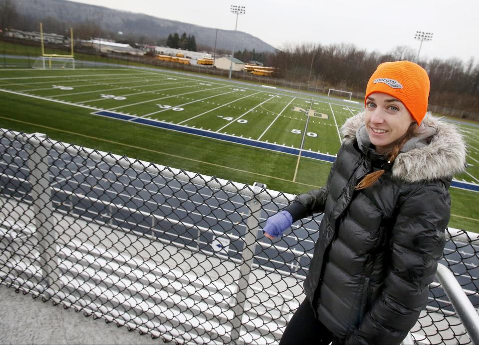 Molly Huddle stands on top of Notre Dame High School's Brewer Memorial Stadium in 2016 following a ceremony where the track and field complex was named after the 2002 graduate and two-time U.S. Olympian.