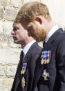 Prince William, left and Prince Harry follow the Land Rover Defender carrying the Duke of Edinburgh's coffin ahead of his funeral at Windsor Castle, in Windsor, England, Saturday April 17, 2021. Prince Philip died April 9 at the age of 99 after 73 years of marriage to Britain's Queen Elizabeth II. (Ian Vogler/Pool via AP)