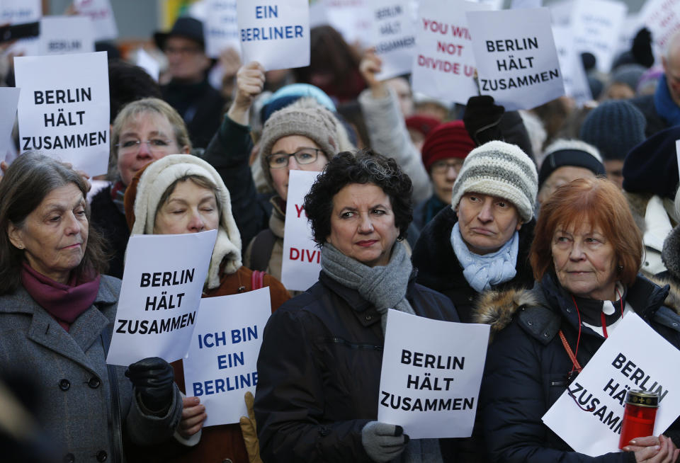 Berliners and refugees gather to sing “We Are The World” in front of the Kaiser Wilhelm Gedaechtniskirche in Berlin