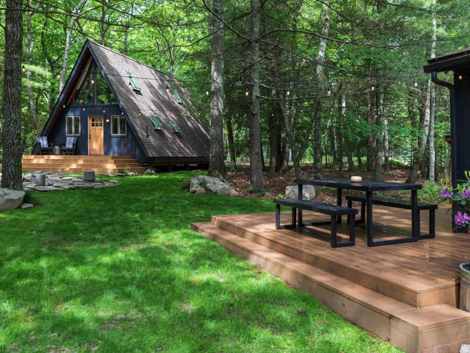 The outdoor deck at the back of the chalet, which is steps away from the A-frame cabin.