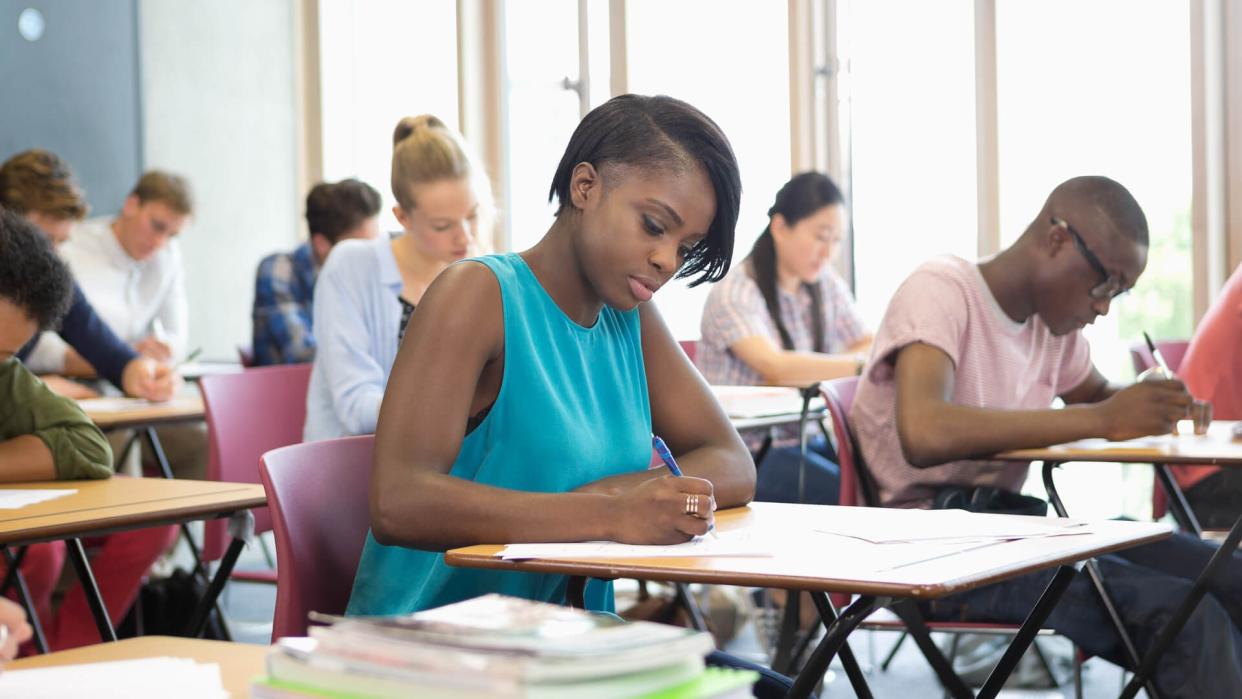 16-17 Years, 18-19 Years, 20-24 Years, African Ethnicity, Asian Ethnicity, Aspirations, Candid, Capital Cities, Casual Clothing, Caucasian Ethnicity, Chair, Chairs, Chinese Ethnicity, Classroom, Concentration, Day, Desks, Education, Exam, Focus, Friendship, Horizontal, Indian Ethnicity, Indoors, Intelligence, Japanese Ethnicity, Large Group Of People, Learning, London, Men, Mixed Race Person, Motivation, Multi-Ethnic Group, Pen, Pens, Sitting, Student, Studying, Teenage Girls, Togetherness, UK, University, University Student, University Students, Women, Writing, Young Men, Young Women, contemplation, england, knowledge