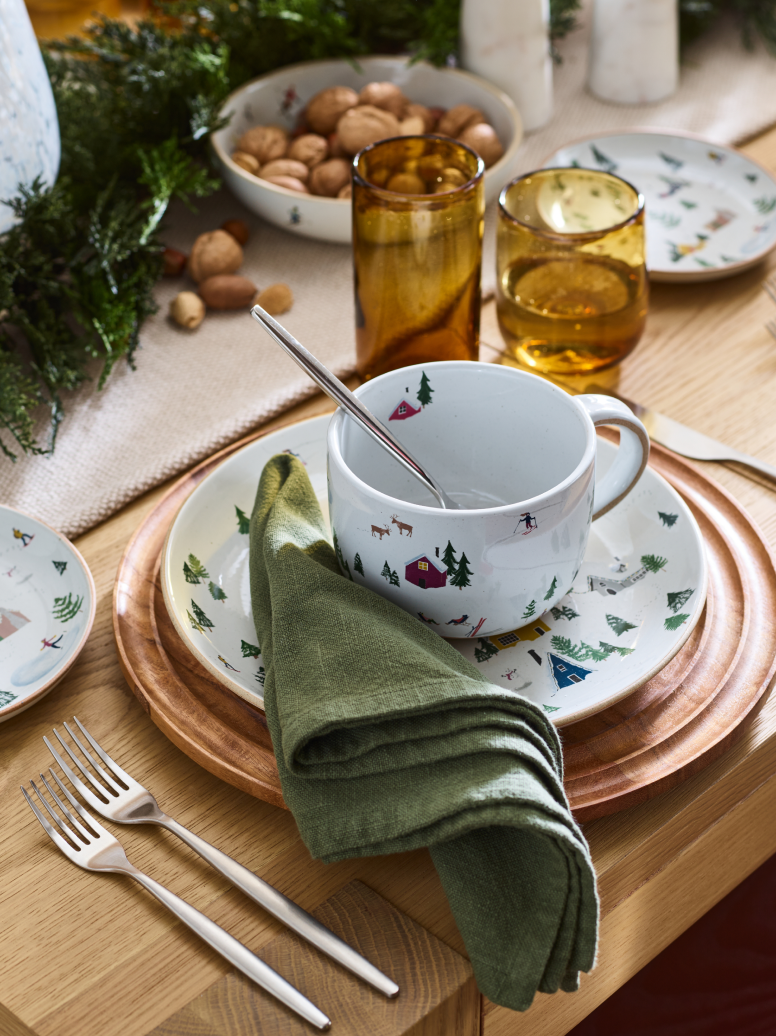 A Christmas table with festive crockery