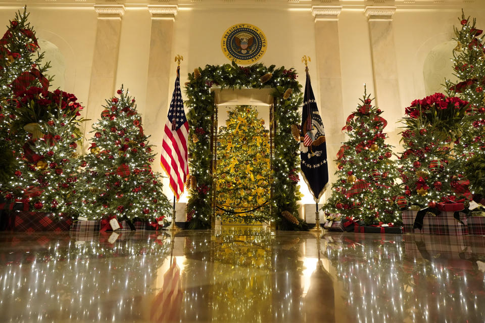 Cross Hall and the Blue Room are decorated during the 2020 Christmas preview at the White House, Monday, Nov. 30, 2020, in Washington. (AP Photo/Patrick Semansky)
